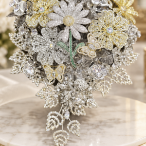 Handbouquet Brooch Cascade: silver and gold brooch bouquet with a trailing crystal leaf cascade