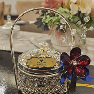 Maheera Glassbowl: silver gift bowl with glass lid, handle, red crystal flower and gold nameplate