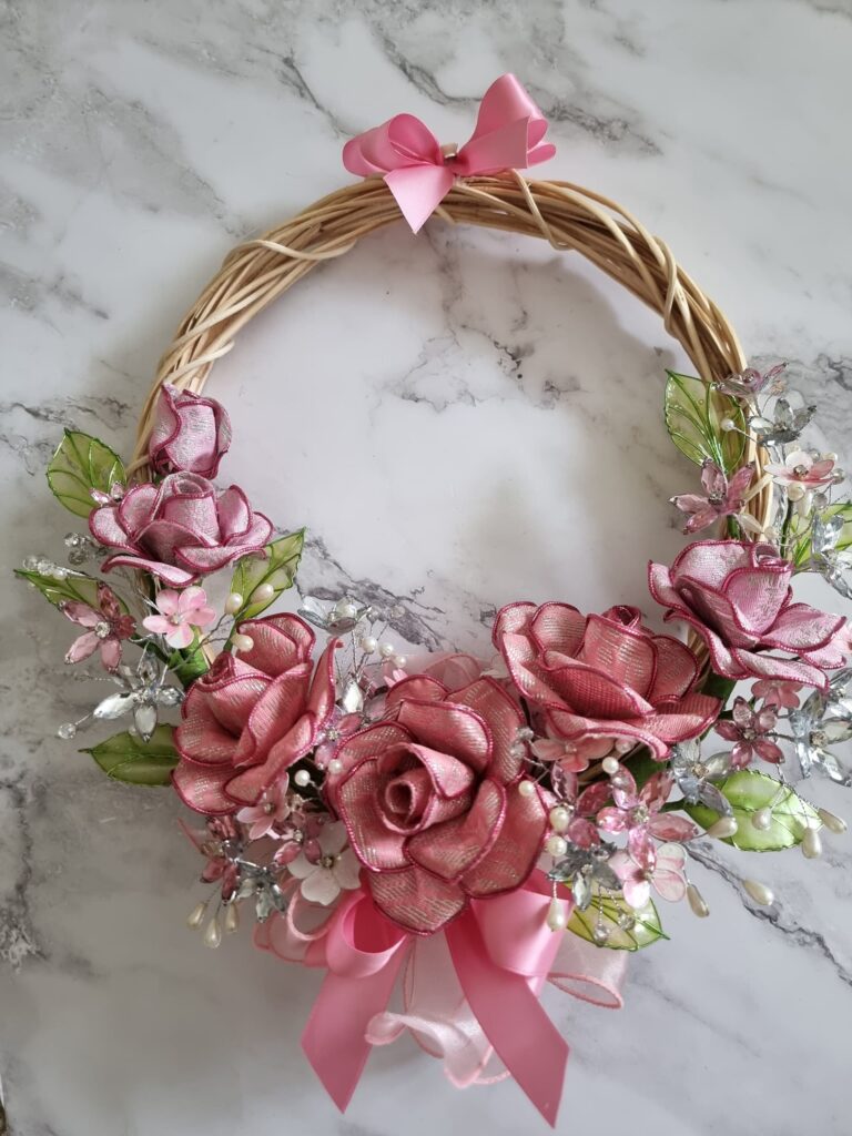 Songket Flower Ring Bouquet: handmade songket roses, crystal flowers and pearls on a rattan ring with pink ribbon