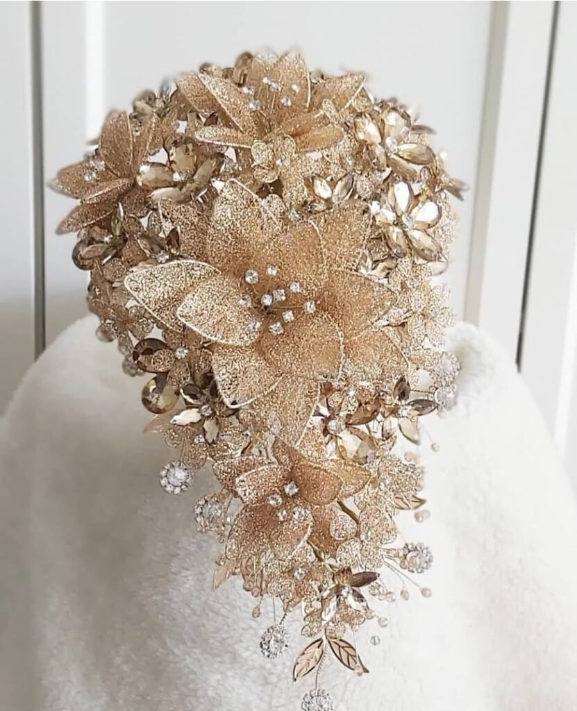 Cascade hand bouquet in champagne gold crystal and gim flowers by Shaja Ratul
